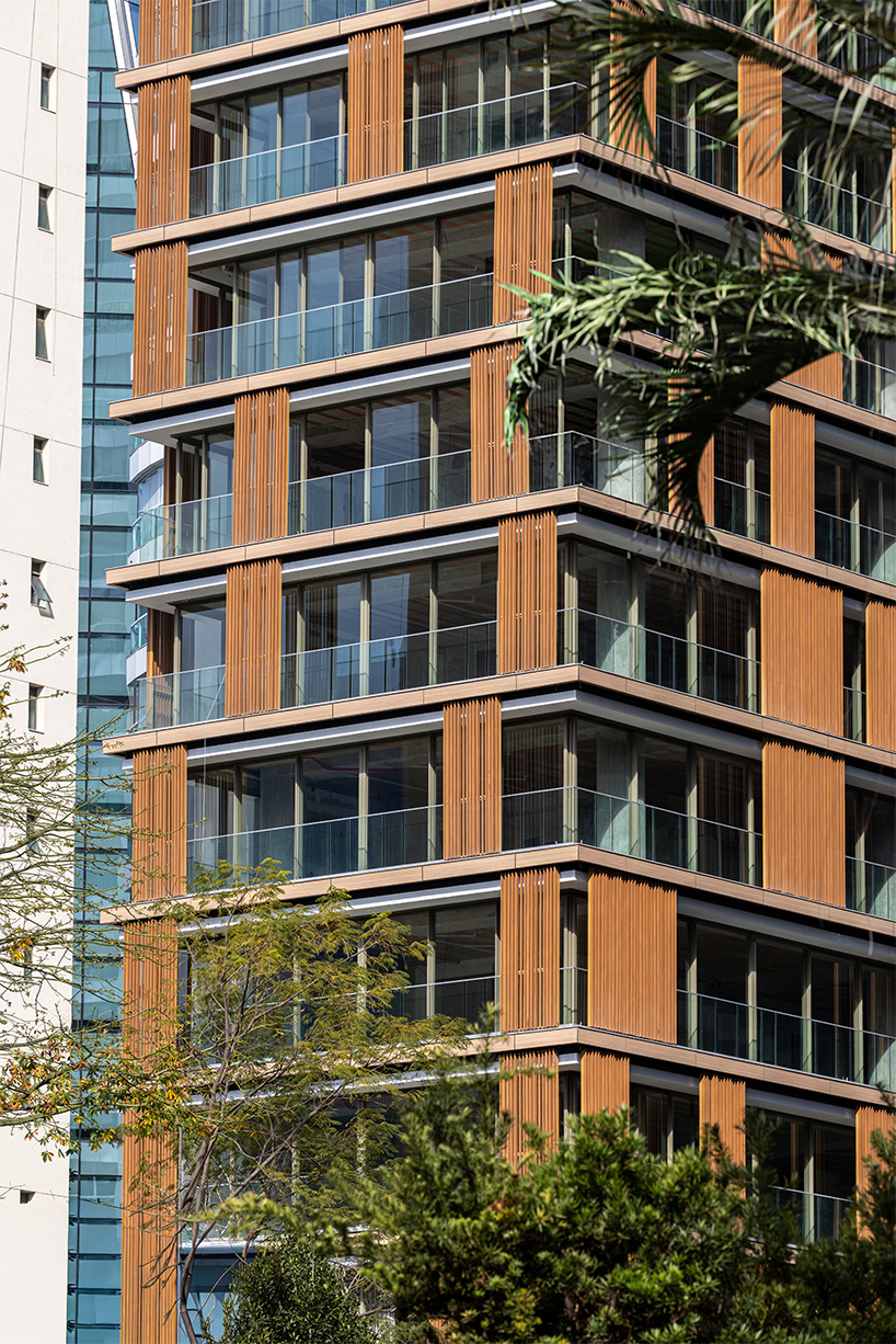 Kinetic wood panels run across the facade of Perkins&Will's residential tower in São Paulo