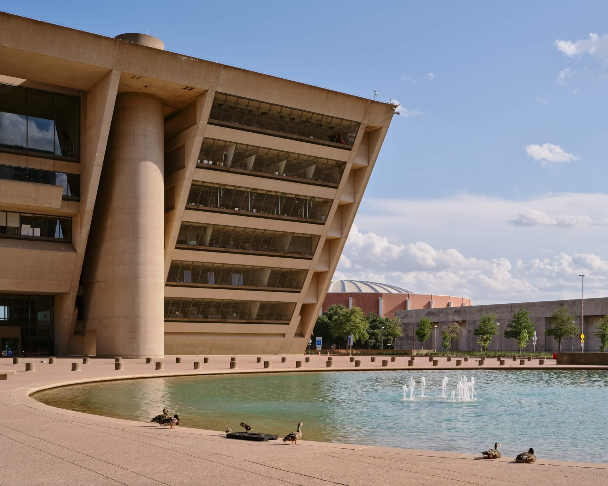 Exterior view of Dallas City Hall with fountain in foreground