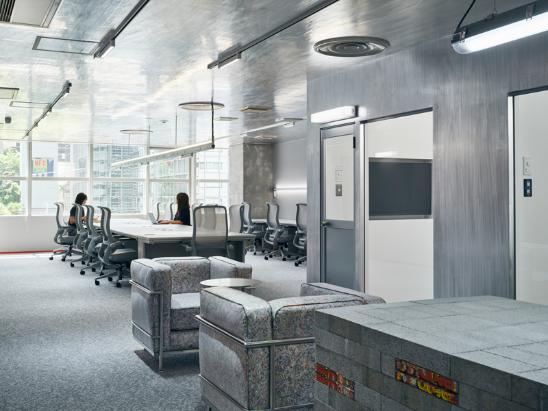 Reflective aluminum creates dynamic movement effects in the manga studio in Tokyo