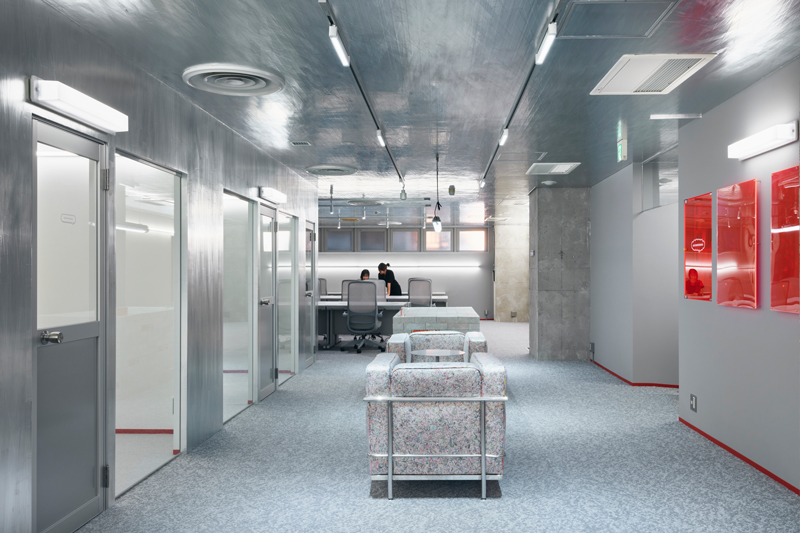 Reflective aluminum creates dynamic movement effects in the manga studio in Tokyo