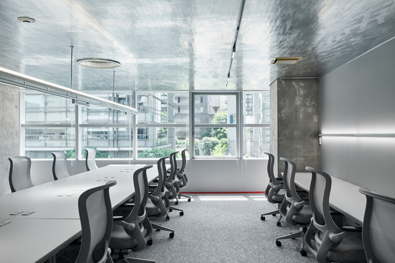 Reflective aluminum creates dynamic movement effects in the manga studio in Tokyo