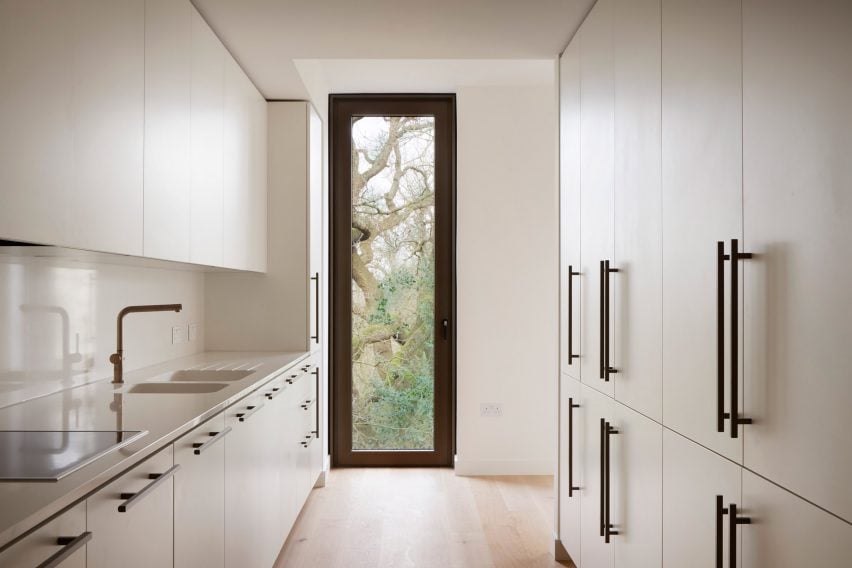 Apartment kitchen with window and view of the trees