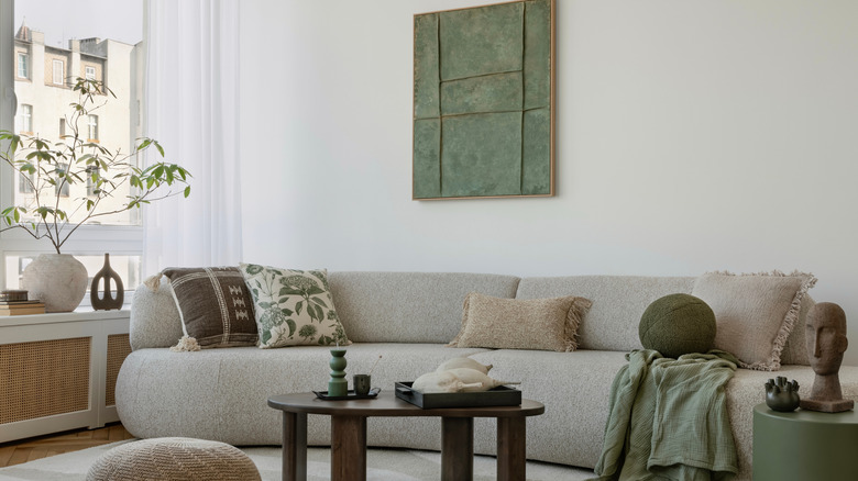Living room with a soft color palette of green, brown and gray