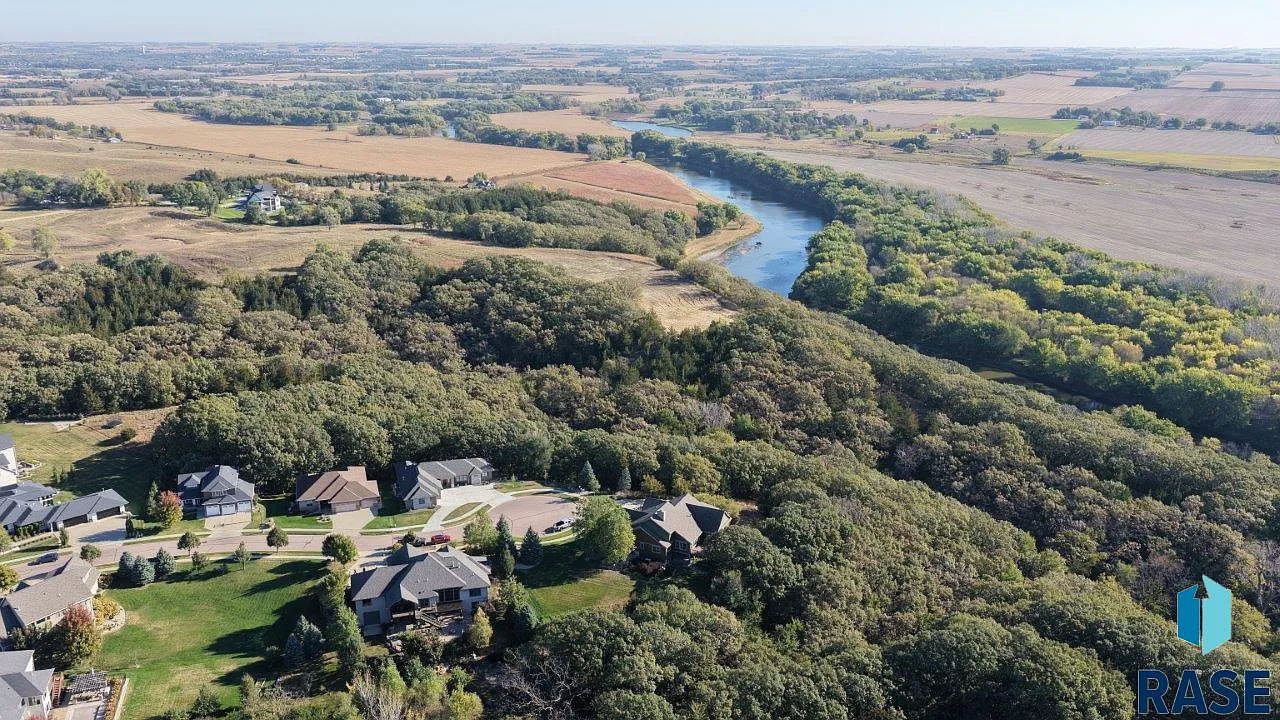 The sprawling home in Arbor's Edge is surrounded by nature and borders the Big Sioux River