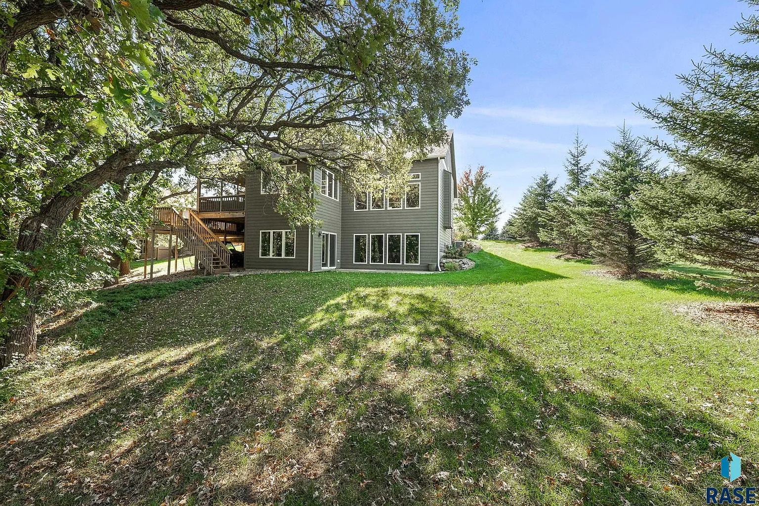 The sprawling home in Arbor's Edge is surrounded by nature and borders the Big Sioux River