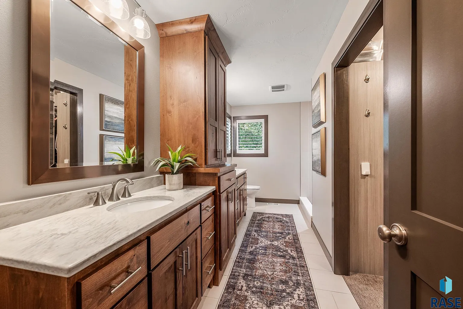 The sprawling home in Arbor's Edge is surrounded by nature and borders the Big Sioux River