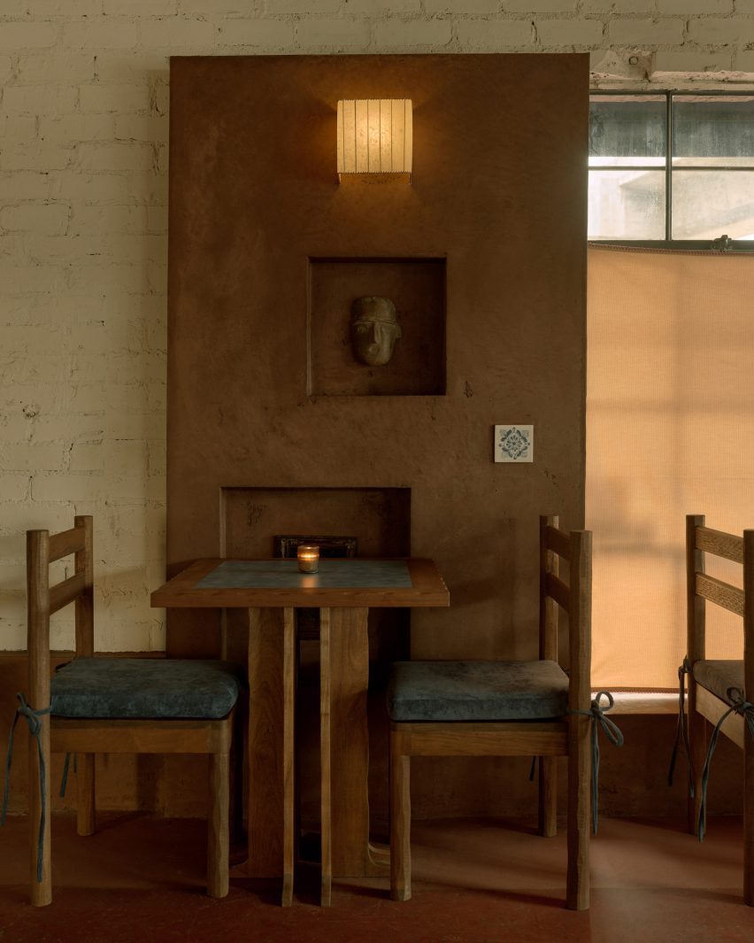 Dining area decorated with warm colors and soft textures