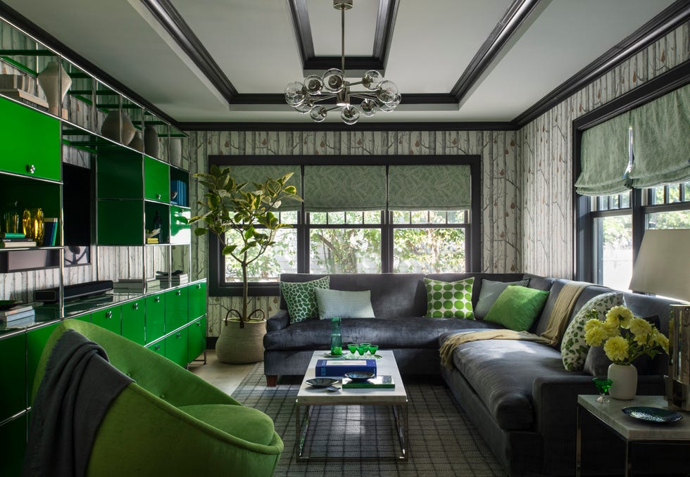 Living room with modern green accents and a cozy seating area