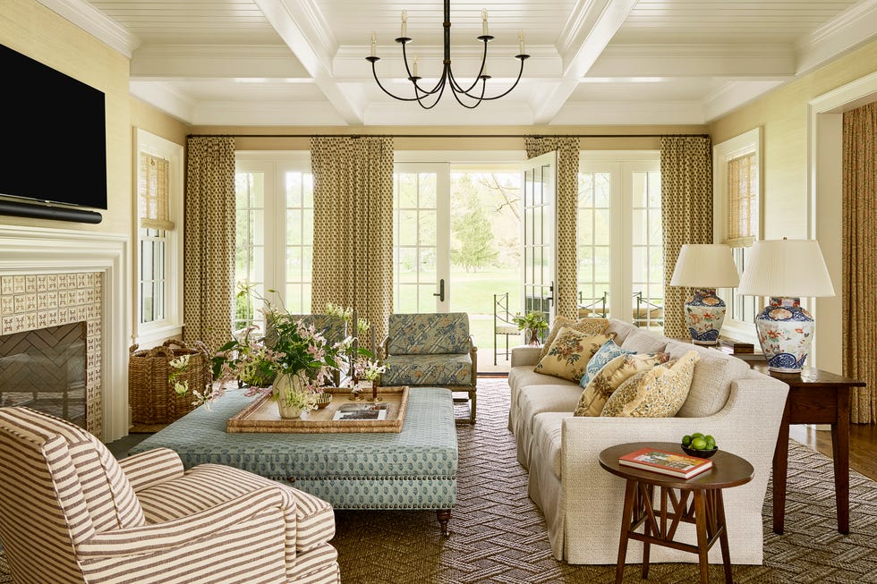 Kendall Rabun Greenbrier West Virginia Home Living Room Living room with couch and chairs around an ottoman with curtains on the windows