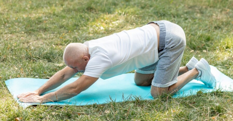 Senior man doing yoga