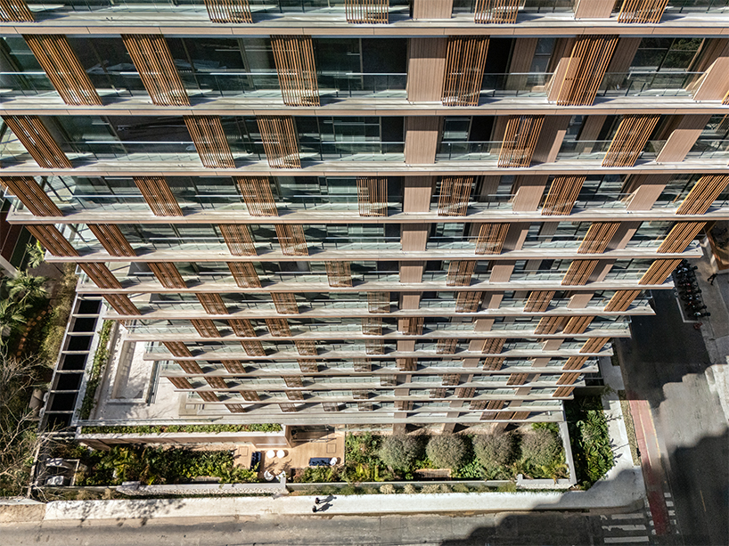 Kinetic wood panels run across the facade of Perkins&Will's residential tower in São Paulo