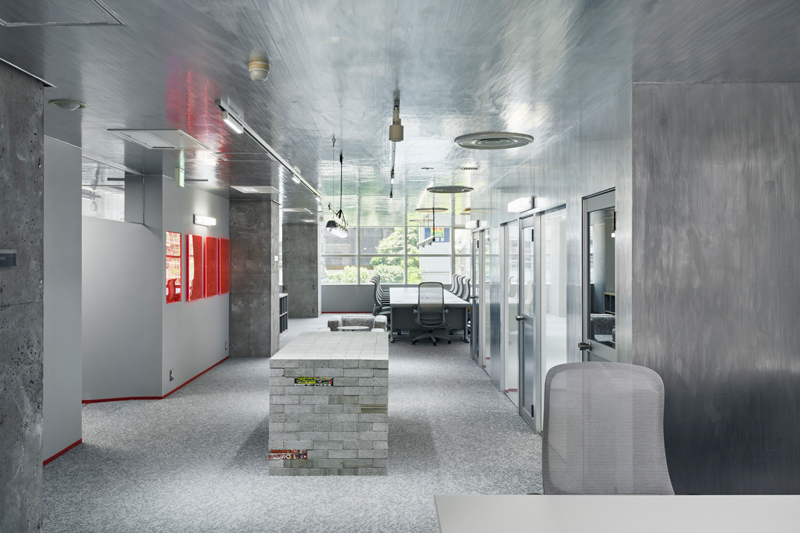 Reflective aluminum creates dynamic movement effects in the manga studio in Tokyo