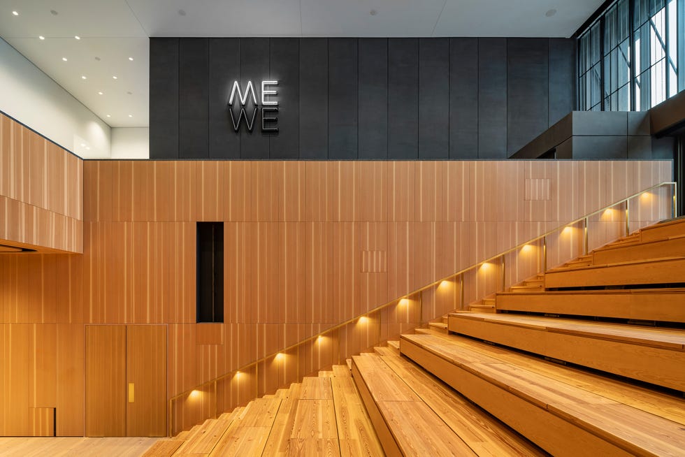 Architectural interior with stairs and signage.