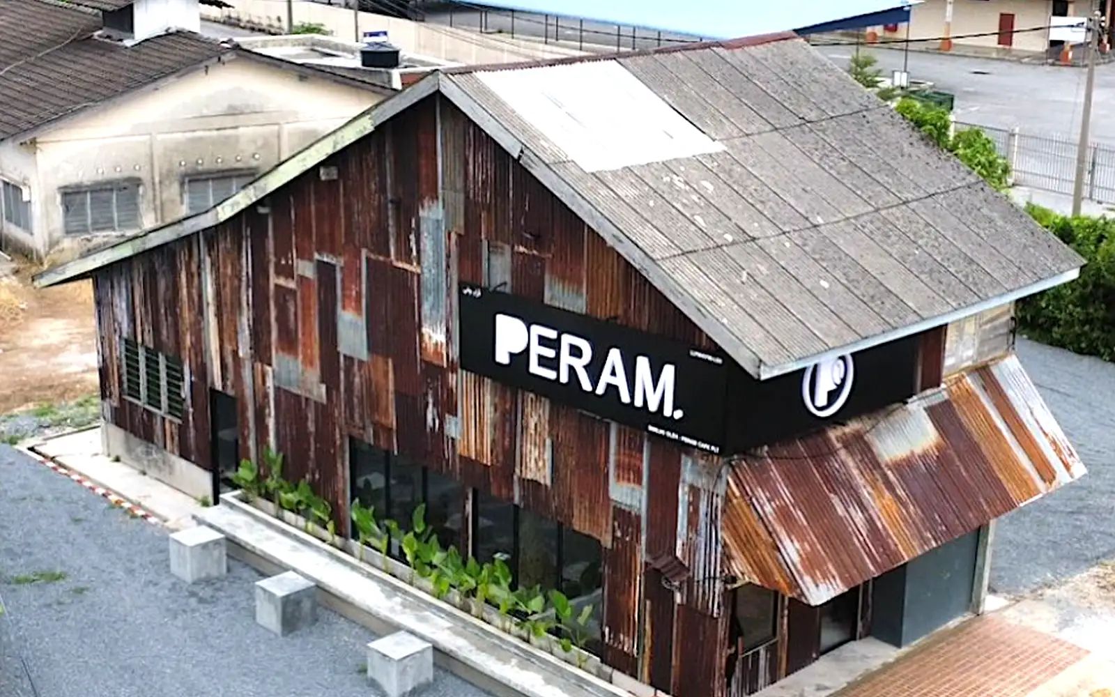 The rusty zinc facade acts like a magnet for this unique Kangar restaurant