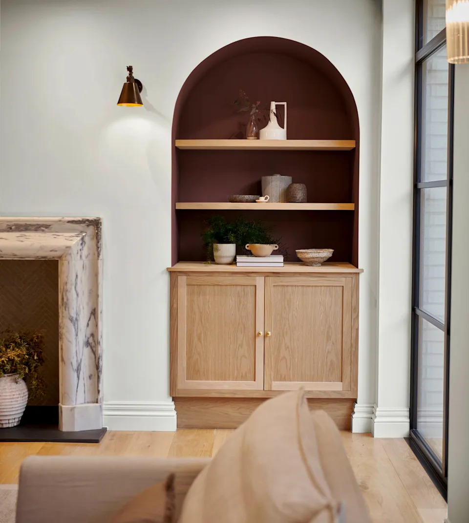 Modern living room with stylish shelves and cupboard