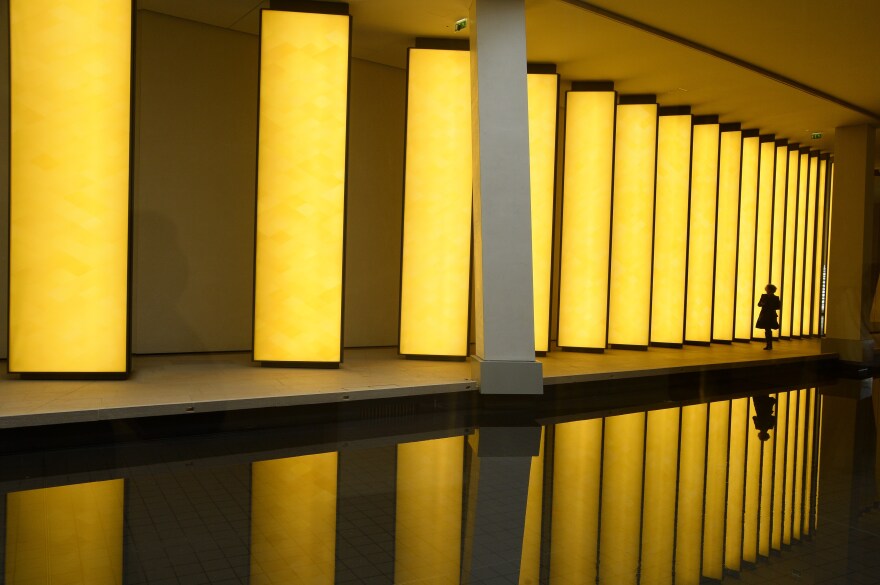 A woman enters the Louis Vuitton Foundation in the Bois de Boulogne in Paris.