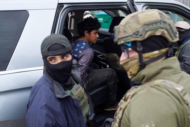 U.S. Border Patrol agents mistakenly arrest a man before releasing him at a construction site in New Orleans on December 3, 2025